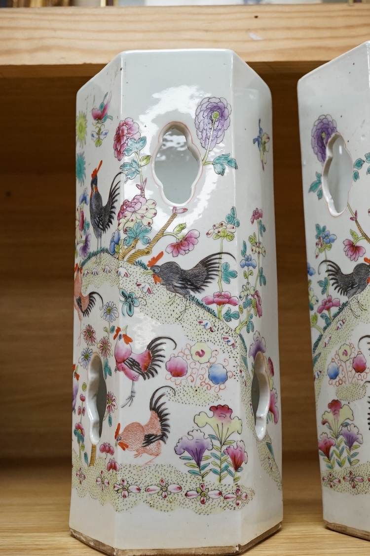 A pair of hexagonal Chinese famille rose porcelain hat stands, 30cm high